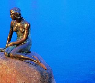 The Little Mermaid of Copenhagen celebrates its 100th birthday, in the middle of a gay pride